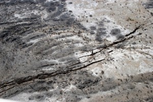Aerial photo of 0.5m-wide cracks and faults formed in Sept 2005