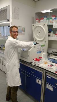 Tim loading up a centrifuge.